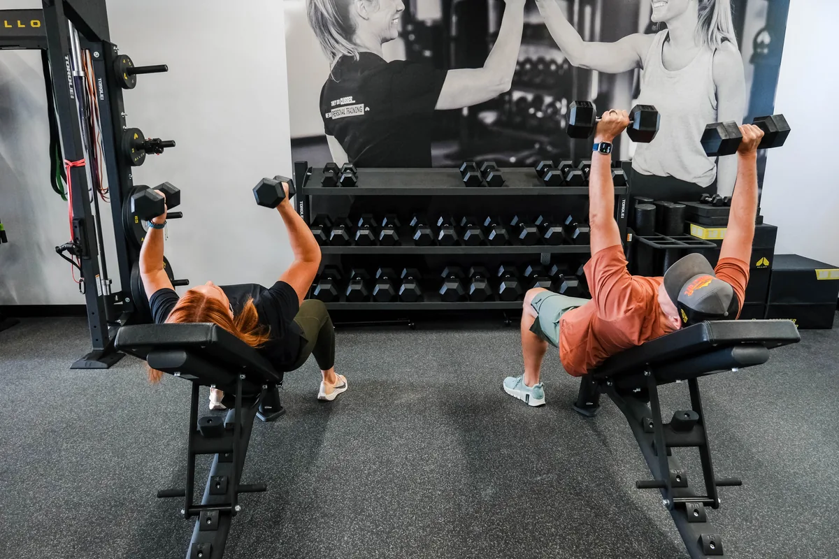 Members training with dumbbells at Alloy Personal Training Colorado Springs